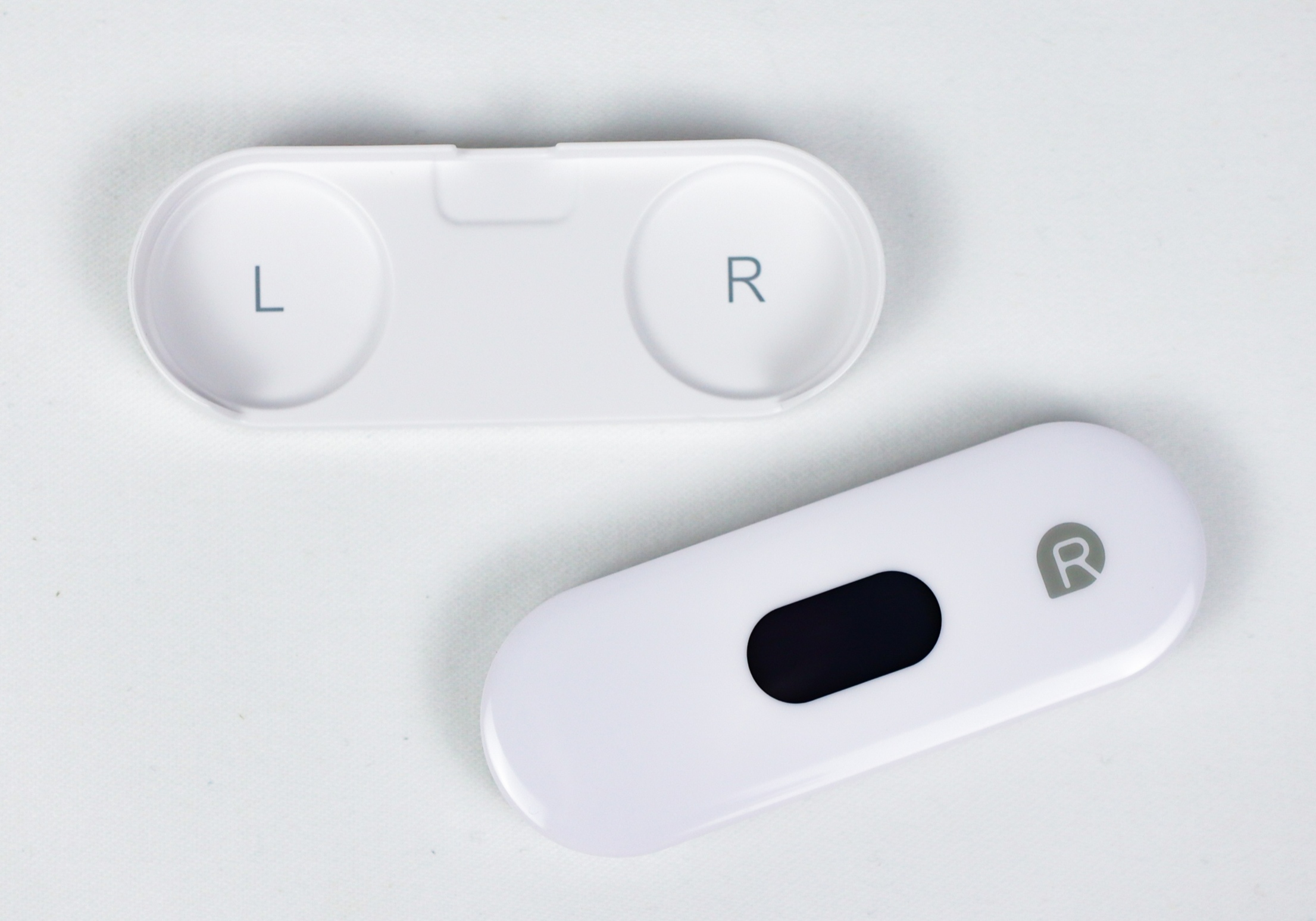 The BioCoherence Sensor Lite ECG recorder shown with its protective cover